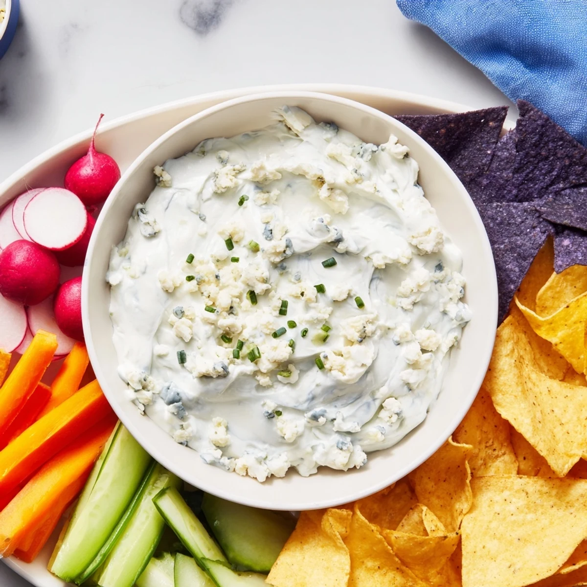 Frozen Pond Blue Dip Platter, a stunning appetizer with creamy blue cheese dip and colorful crudités.