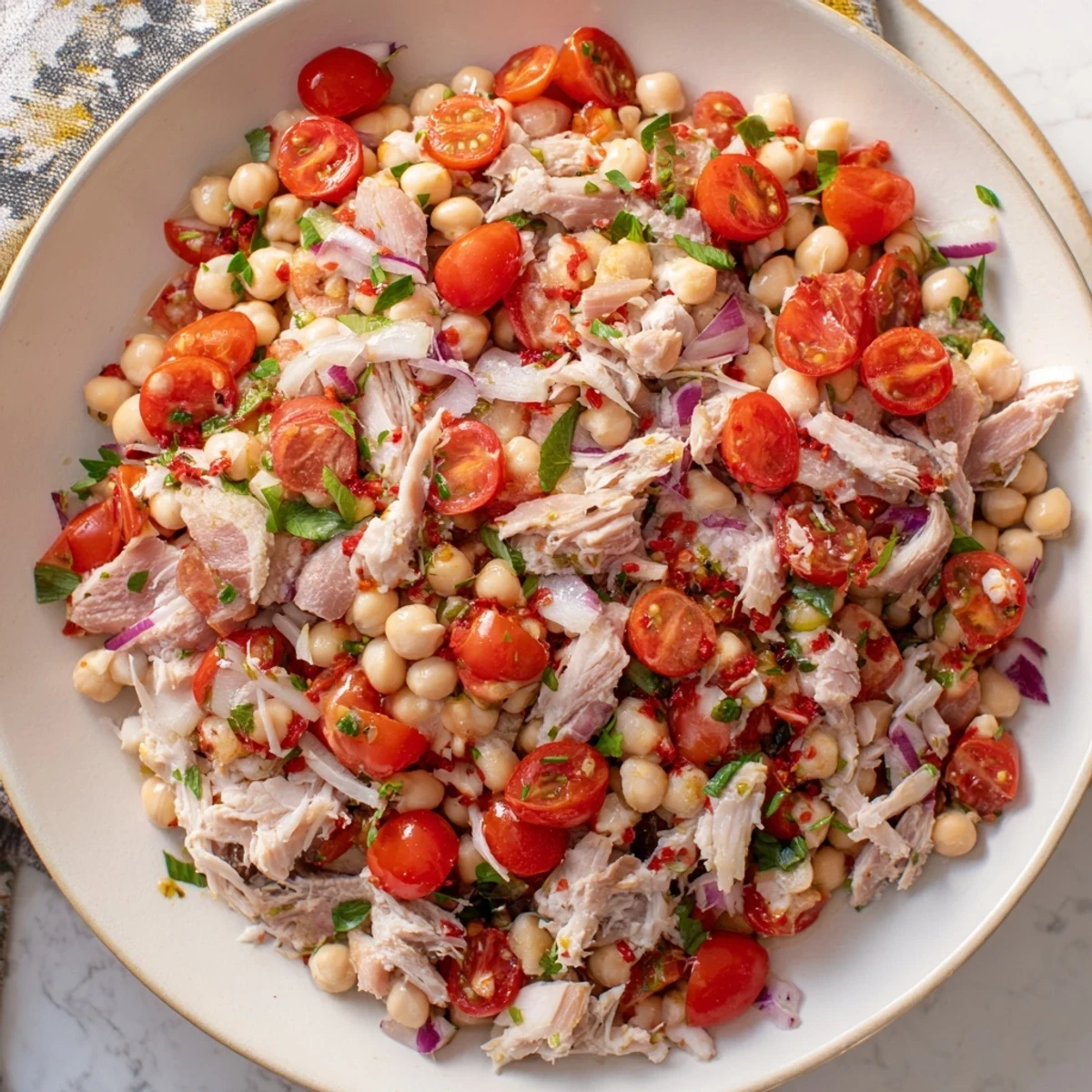 Creamy Dense Chickpea and Tuna Salad with red onion, a flavorful and protein-packed pescatarian dish.