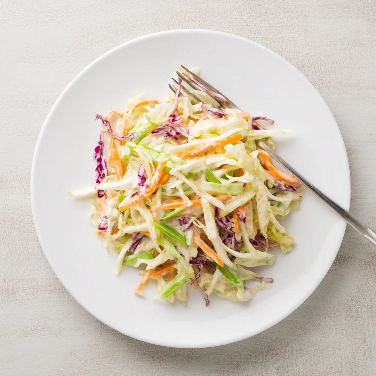 Bright Best Cabbage Coleslaw tossed with green onions, ready to be paired with grilled meats.