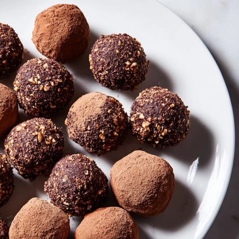Dark Chocolate Truffles, dusted with cocoa, ready to melt in your mouth and satisfy any chocolate craving.