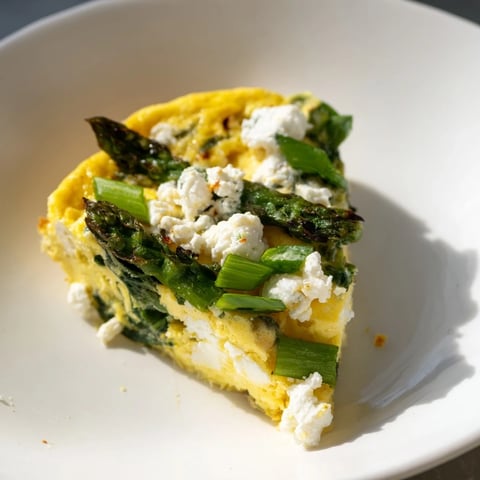 Golden crust of Meadow-Soft Cozy Plate: Frittata with Spring Greens, rich with goat cheese.