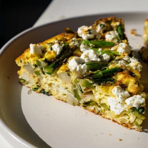 Imagine the fluffy, delicious Meadow-Soft Cozy Plate: Frittata, filled with vibrant greens and cheese.