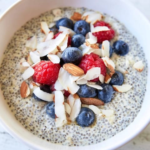 A close-up of chilled Poppy Seed Chia Pudding showing its thick, gel-like texture and speckled seeds, perfect for a healthy dessert.  