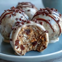 Delicious no-bake peanut butter oat bites with chocolate chips, ready to enjoy as a wholesome snack.